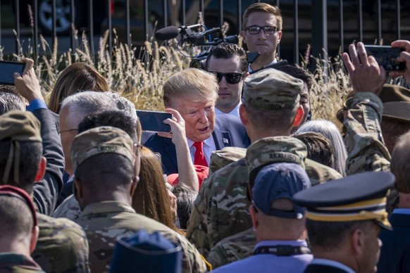 epa07835540 President Donald Trump greets attendees after speaking at a remembrance ceremony of the 18th anniversary of the terrorist attacks on US soil, in Arlington, Virginia, USA, 11 September 2019 ...