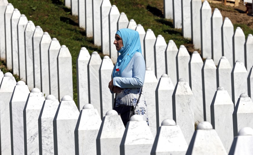 epa08540264 A Bosnian Muslim woman pray during the funeral in the Potocari Memorial Center, Srebrenica, Bosnia and Herzegovina, 11 July 2020, where 9 newly-identified Bosnian Muslims.The burial was pa ...