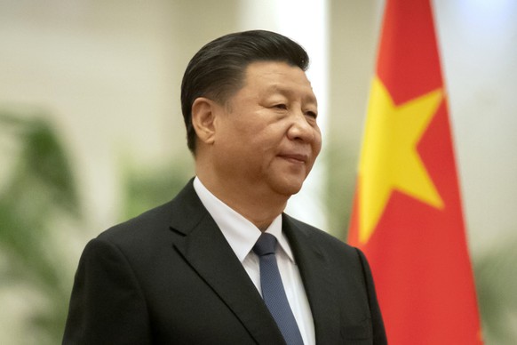 FILE - In this Jan. 6, 2020, file photo, Chinese President Xi Jinping stands during a welcome ceremony for Kiribati&#039;s President Taneti Maamau at the Great Hall of the People in Beijing. Xi will v ...