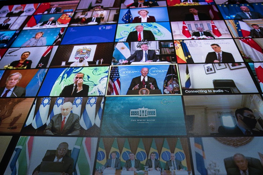 epa09152634 A video monitor shows President Joe Biden speaking during a virtual international Leaders Summit on Climate, in the East Room of the White House, in Washington, DC, USA, 22 April 2021. US  ...