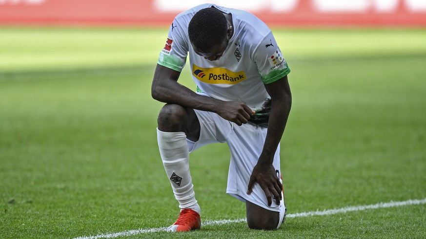 Moenchengladbach&#039;s Marcus Thuram taking the knee after scoring his side&#039;s second goal during the German Bundesliga soccer match between Borussia Moenchengladbach and Union Berlin in Moenchen ...
