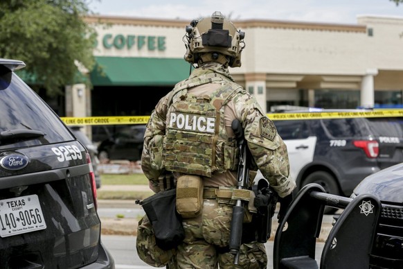 Austin police, SWAT and medical personnel respond to an active shooter situation located Great Hills Trail in Northwest Austin, Texas, on Sunday, April 18, 2021. Emergency responders say several peopl ...