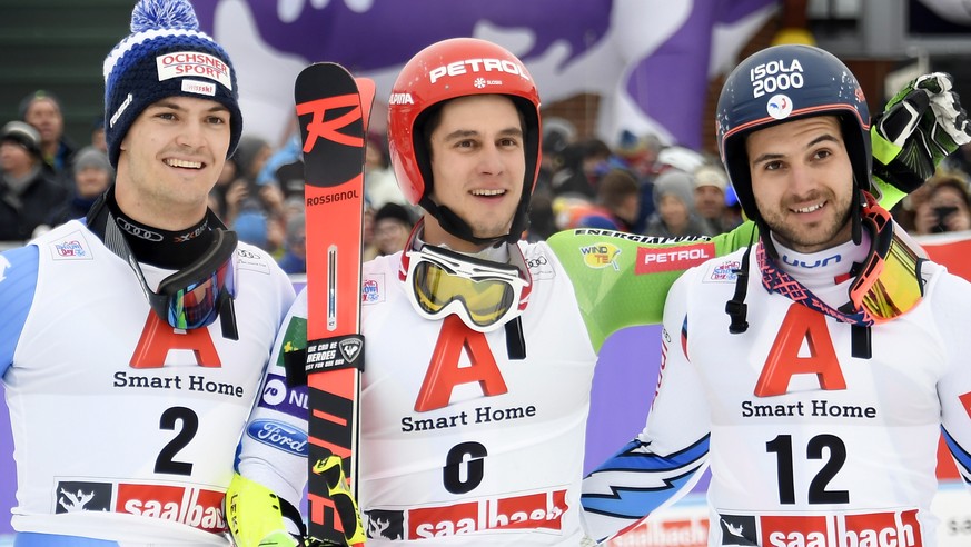 epa07240060 (L-R) Second placed Loic Meillard of Switzerland, winner Zan Kranjec of Slovenia and third placed Mathieu Faivre of France pose after the Mens Giant Slalom race at the FIS Alpine Skiing Wo ...