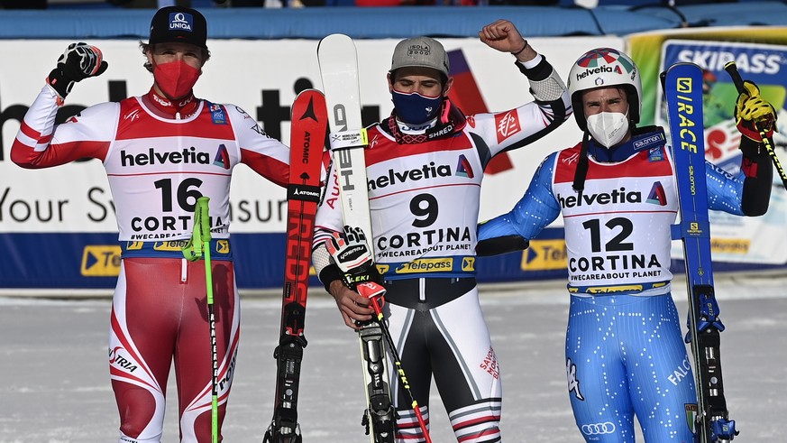 epa09023805 Third placed Marco Schwarz of Austria (L), winner Mathieu Faivre of France (C) and second placed Luca De Aliprandini (R) of Italy celebrate after the Men&#039;s Giant Slalom race at the FI ...