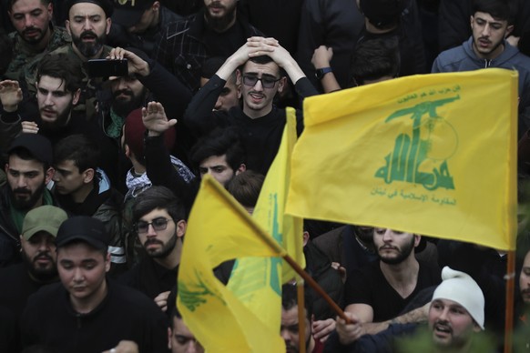 People mourn during the funeral of five Hezbollah fighters who were killed in Syria&#039;s northwestern Idlib region, in the southern suburb of Beirut, Lebanon, Sunday, March 1, 2020. The fighters wer ...