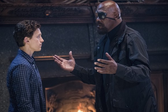 This image released by Sony Pictures shows Tom Holland, left, and Samuel L. Jackson in a scene from &quot;Spider-Man: Far From Home.&quot; (Jay Maidment/Columbia Pictures/Sony via AP)
Tom Holland (Fin ...