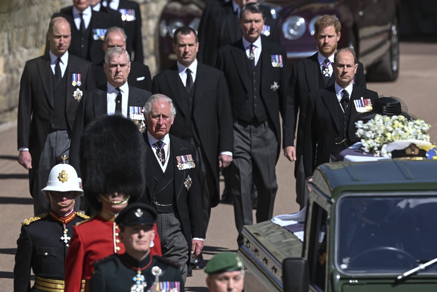 From front left, Britain&#039;s Prince Charles, Prince Andrew. Prince Edward, Prince William, Peter Phillips, Prince Harry, Earl of Snowdon and Tim Laurence follow the coffin the coffin makes it&#039; ...