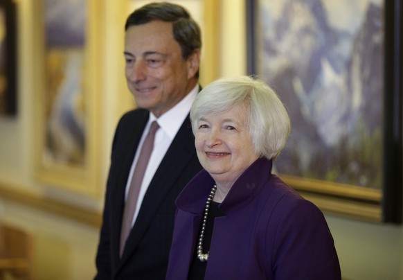 FILE - In this Aug. 22, 2014 file photo, Federal Reserve Chair Janet Yellen, right, and European Central Bank President Mario Draghi walk together during the Jackson Hole Economic Policy Symposium at  ...