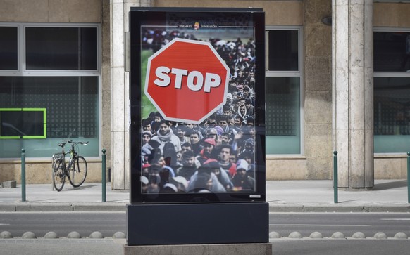 An anti-migration billboard from the Hungarian government is placed on a street in Budapest, Wednesday, April 4, 2018. Hungarian Prime Minister Viktor Orban is betting that his relentless campaign aga ...