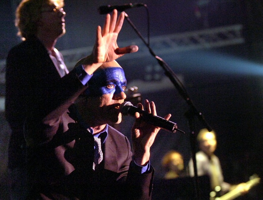 Michael Stipe, center, of the band R.E.M., USA, performs during a concert at the Open Air Festival in St. Gallen, Switzerland, late Saturday, July 2, 2005. (KEYSTONE/Regina Kuehne)