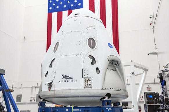 This April 2020 photo made available by SpaceX shows the company&#039;s Crew Dragon spacecraft undergoing final processing at Cape Canaveral Air Force Station, Fla,, in preparation for the May 27, 202 ...