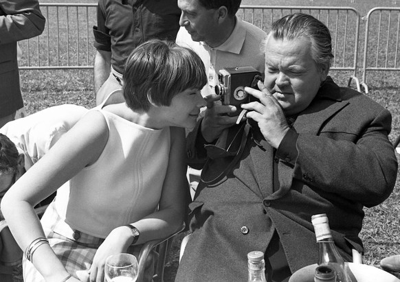 In this May 8, 1966 file photo actress Macha Meril peers into the lens of the camera as she is filmed by Orson Welles during the garden party of the Cannes Film Festival at the Mandelieu Golf Club. (A ...