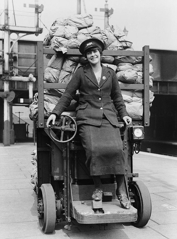Women In The First World War, Industry, Transport and Agriculture: A woman parcel truck driver of the Great Eastern Railway Company driving a battery powered rail parcel truck. She has chosen to wear  ...
