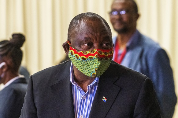 FILE �?? In this Friday, April 24, 2020 file photo, South African President Cyril Ramaphosa visits a field hospital in Johannesburg. Ramaphosa has announced he has gone into quarantine after coming in ...