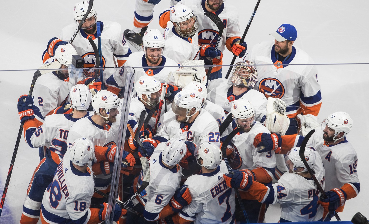 New York Islanders celebrate a win over the Tampa Bay Lightning during the second overtime in Game 5 of the NHL hockey Eastern Conference final, Tuesday, Sept. 15, 2020, in Edmonton, Alberta. (Jason F ...