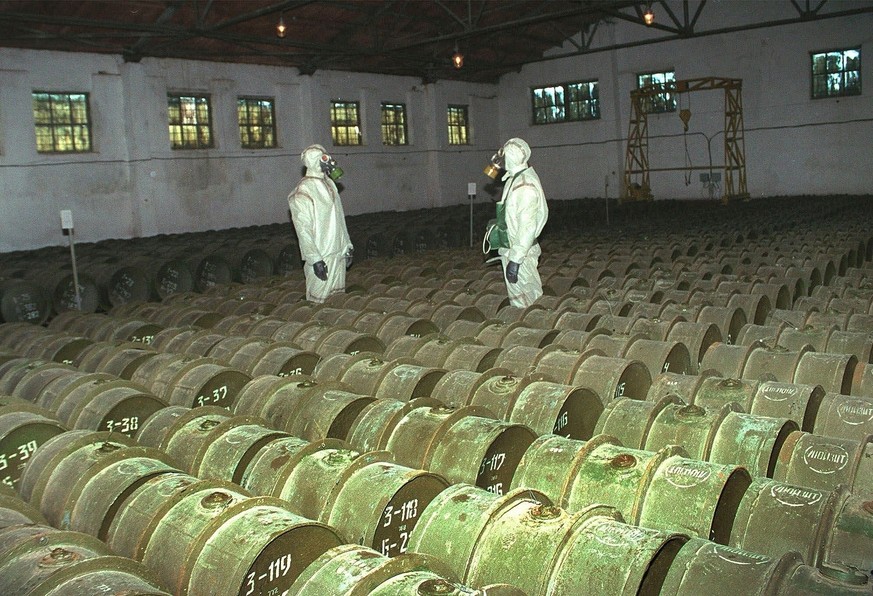 FILE - In this Saturday, May 20, 2000 file photo, two Russian soldiers make a routine check of metal containers with toxic agents at a chemical weapons storage site in the town of Gorny, 124 miles (20 ...
