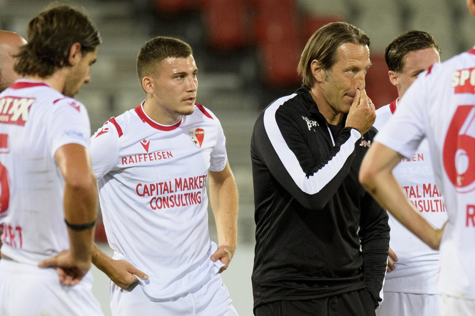 Sion&#039;s headcoach Paolo Tramezzani, right, looks desapointed next to Sion&#039;s forward Filip Stojilkovic, left, after the first Super League soccer match after the Coronavirus lockdown, between  ...