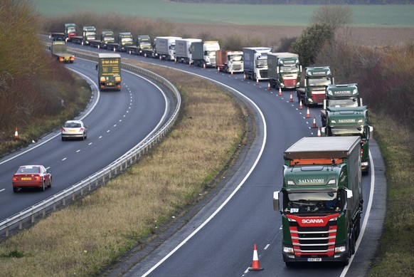 epaselect epa07267320 Lorries are seen queuing in the A259 road during a test drive to the Port of Dover during a trial of how roads will cope in case of a no-deal Brexit in Kent, Britain, 07 January  ...