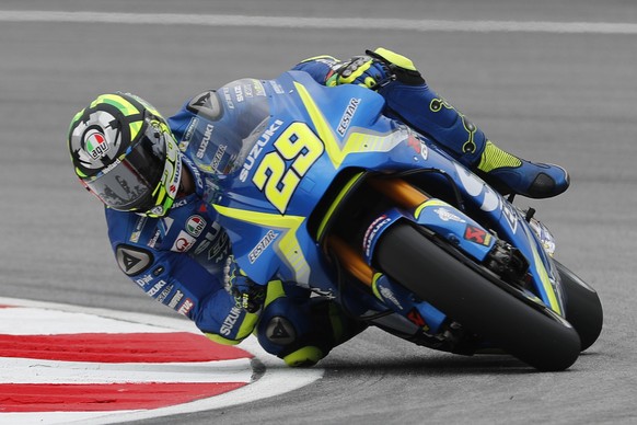 FILE -- In this Oct. 27, 2017 file photo Italy&#039;s MotoGP rider Andrea Iannone steers his Suzuki during the first practice session of the Malaysia MotoGP at the Sepang International circuit in Sepa ...
