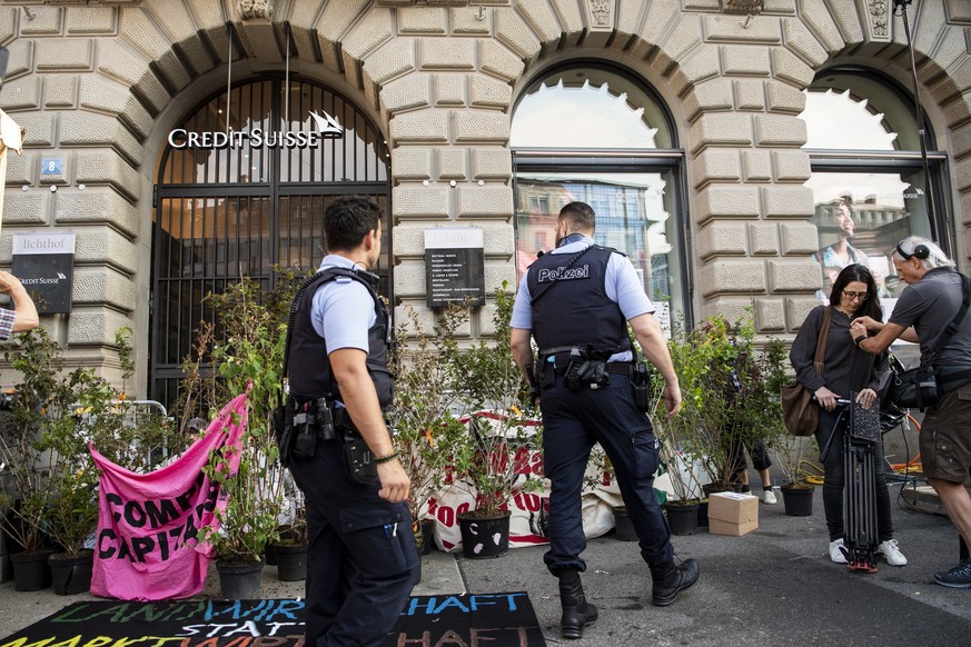 epa07702719 A group of climate activists from the Collective Climate Justice organization is blocking the entrance to the Swiss bank Credit Suisse at Paradeplatz in Zurich, Switzerland, 08 July 2019.  ...