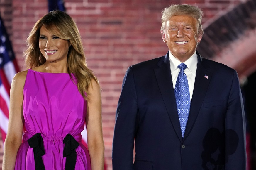 President Donald Trump and first Lady Melania Trump stand on stage after Vice President Mike Pence spoke on the third day of the Republican National Convention at Fort McHenry National Monument and Hi ...