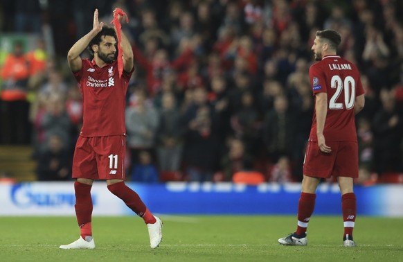 Liverpool forward Mohamed Salah applauds the fans as he goes off the pitch after being substituted during the Champions League group C soccer match between Liverpool and Red Star at Anfield stadium in ...