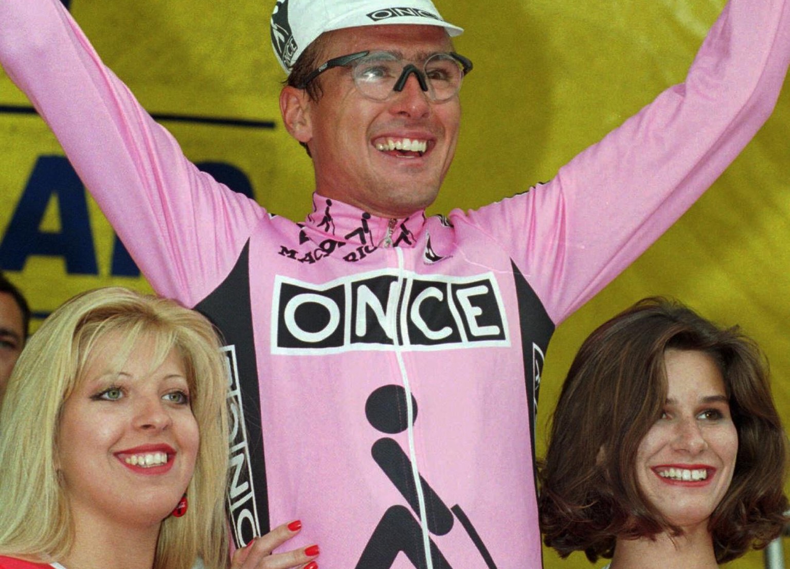 Alex Zuelle of Switzerland waves on the podium after he won the 9th stage of the Tour de France cycling race between Le Grand Bornand and La Plagne, French Alps Tuesday July 11, 1995.(AP Photo/Peter D ...