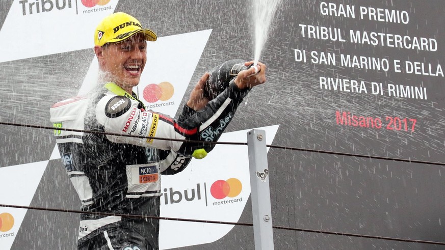 epa06196235 Swiss rider Dominique Aegerter of Kiefer Racing celebrates on the podium after winning the Moto2 Grand Prix of San Marino and Riviera of Rimini at Misano circuit, in Misano Adriatico, Ital ...