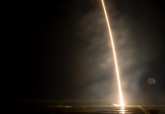 epa08823243 A long-exposure image shows a SpaceX Falcon 9 rocket carrying the company&#039;s Crew Dragon spacecraft launching for NASA&#039;s SpaceX Crew-1 mission, to the International Space Station, ...