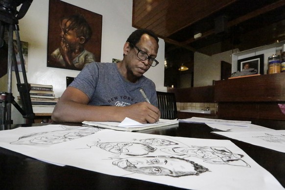 Kenyan cartoonist and commentator Patrick Gathara works on drawing cartoons at his house in Nairobi, Kenya Thursday, Nov. 5, 2020. As the United States twists itself into knots over its most contentio ...
