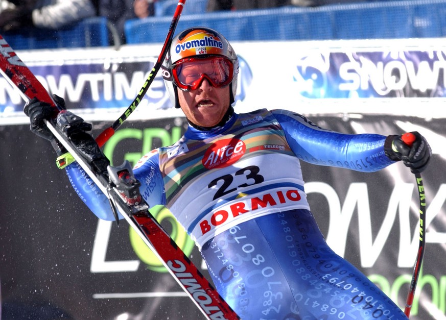 Swiss Didier Cuche celebrates at finish line after taking fifth place at the World Cup men&#039;s downhill in Bormio, Italy, Saturday, Jan. 11, 2003. (AP Photo/Armando Trovati)