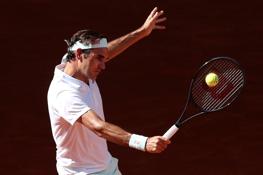 epa07558867 Roger Federer of Switzerland in action against Gael Monfils of France during their third round match of the Mutua Madrid Open tennis tournament at the Caja Magica complex in Madrid, Spain, ...