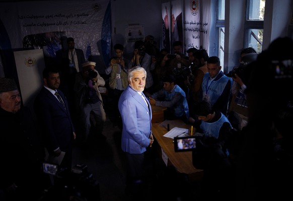 epa07875588 Presidential candidate Dr Abdullah Abdullah (C) casts his ballot during the presidential elections, in Kabul, Afghanistan, 28 September 2019. The Afghan presidential elections will take pl ...