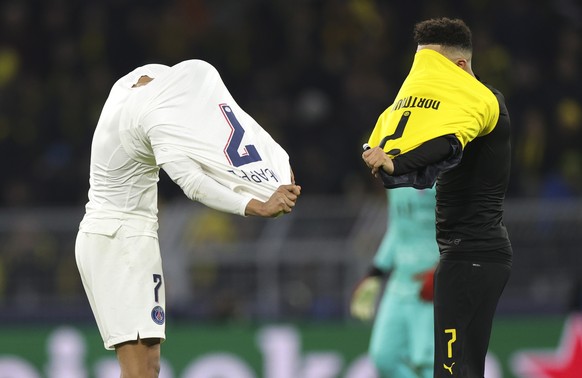 epa08226880 PSG&#039;s Kylian Mbappe (L) and Dortmund&#039;s Jadon Sancho (R) after the UEFA Champions League round of 16 first leg soccer match between Borussia Dortmund and Paris Saint-Germain in Do ...