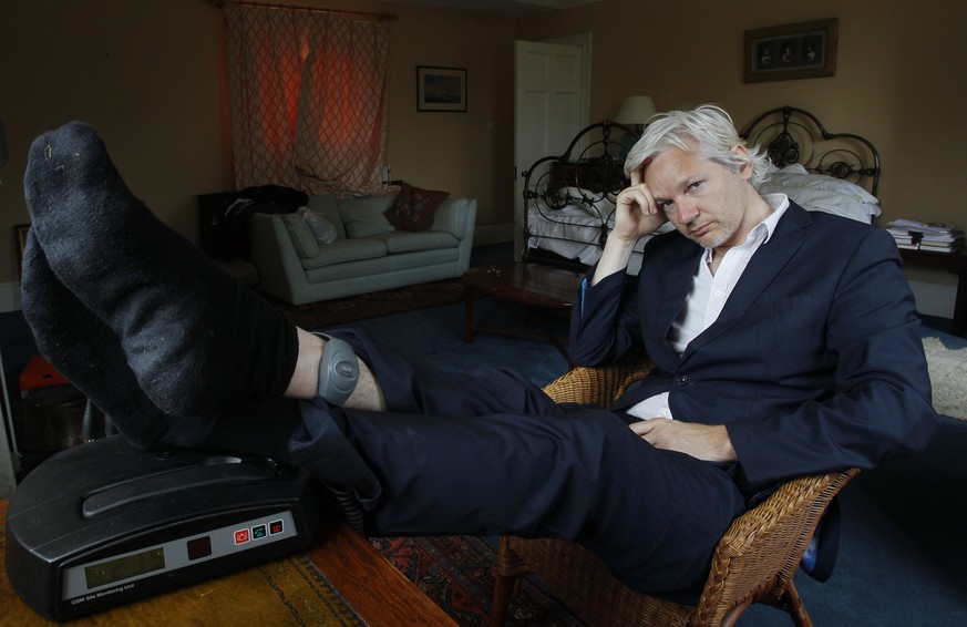 FILE - In this Wednesday, June 15, 2011 file photo, WikiLeaks founder Julian Assange is seen with his ankle security tag at the house where he is required to stay, near Bungay, England. Judge Vanessa  ...