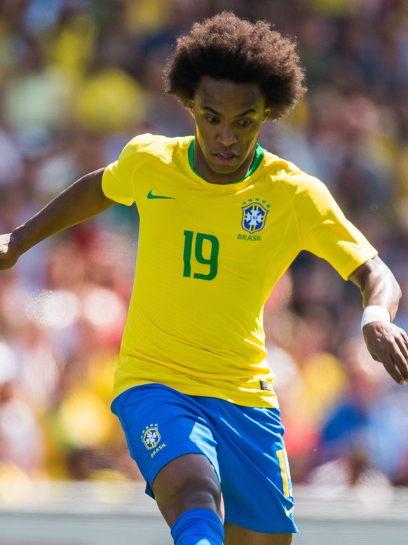 epa06783047 Brazil’s Willian in action during the international soccer friendly match between Brazil and Croatia at Anfield in Liverpool, Britain, 03 June 2018. EPA/PETER POWELL