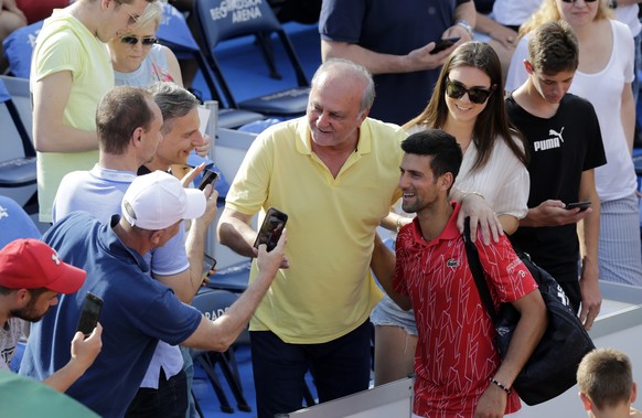 epa08503558 (FILE) - Novak Djokovic of Serbia poses for a photo with fans after a match at the Adria Tour tennis tournament in Belgrade, Serbia, 13 June 2020 (reissued 23 June 2020). According to medi ...