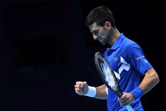 epa08831432 Novak Djokovic of Serbia in action against Alexander Zverev of Germany during their group stage match at the ATP Finals tennis tournament in London, Britain, 20 November 2020. EPA/ANDY RAI ...