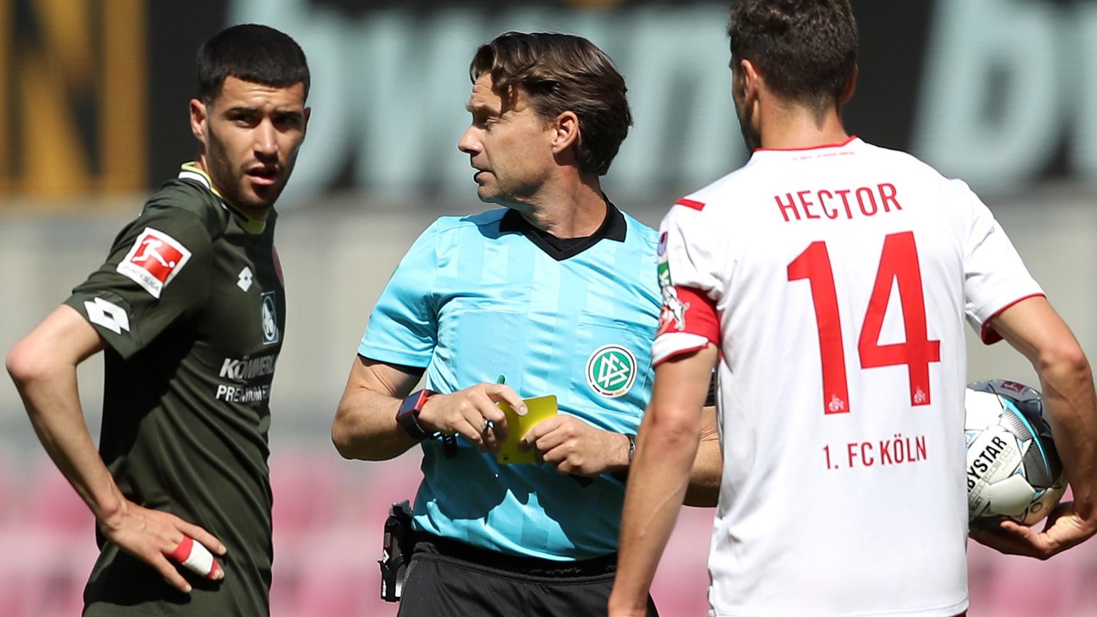 epa08427903 Referee Guido Winkmann discusses with Jonas Hector (R) of 1. FC Koeln during the German Bundesliga soccer match between 1. FC Koeln and 1. FSV Mainz 05 at RheinEnergieStadion in Cologne, G ...