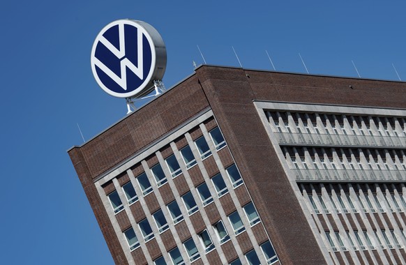 FILE - In this Monday, April 27, 2020. file photo, The Volkswagen logo stand on the top of a VW headquarters building in Wolfsburg, Germany. Volkswagen is gradually launch the production at important  ...