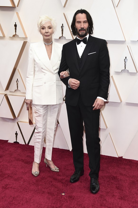 Patricia Taylor, left, and Keanu Reeves arrive at the Oscars on Sunday, Feb. 9, 2020, at the Dolby Theatre in Los Angeles. (Photo by Jordan Strauss/Invision/AP)
Patricia Taylor,Keanu Reeves