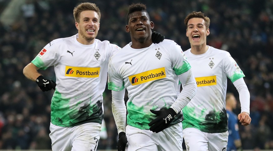 epa08037478 Moenchengladbach&#039;s Breel Embolo (C) celebrates scoring the fourth goal with Moenchengladbach&#039;s Florian Neuhaus (R) and Moenchengladbach&#039;s Patrick Herrmann (L) during the Ger ...