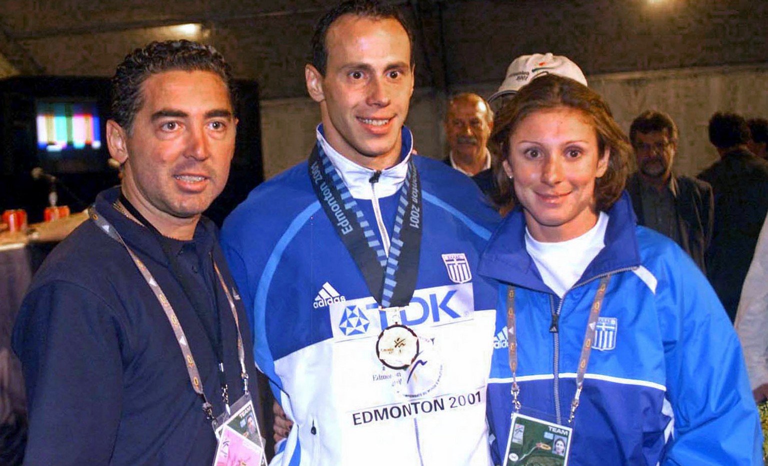 This is an August 9, 2001 photo of Greek athletes Konstantinos Kenteris, center, and Katerina Thanou, the 100-meter silver medalist in Sydney, right with their coach Christos Tsekos taken at the World ...