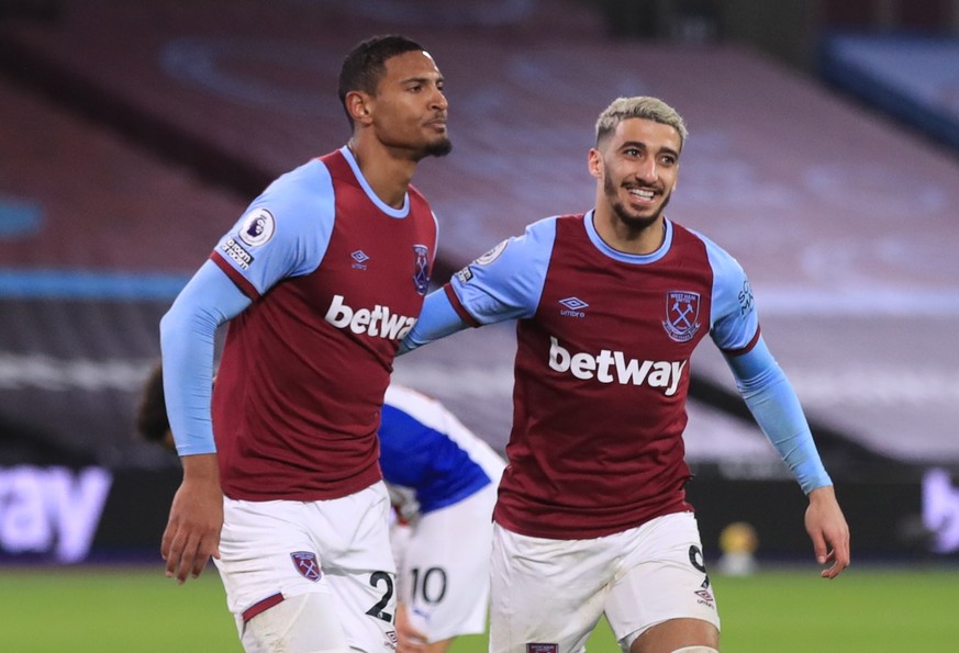 epa08888858 West Ham&#039;s Sebastien Haller (L) celebrates with Said Benrahma (R) after scoring the 1-1 goal during the English Premier League soccer match between West Ham United and Crystal Palace, ...