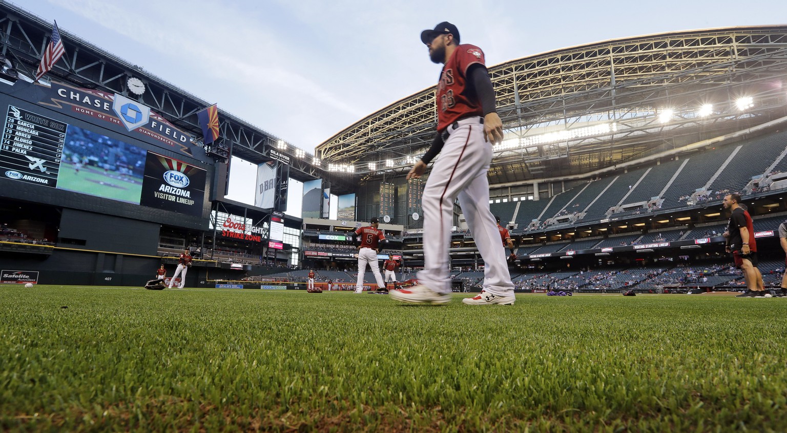 FILE - In this March 25, 2019, file photo, Arizona Diamondbacks&#039; Steven Souza Jr. walks on new turf at the team&#039;s home field before an exhibition baseball game against the Chicago White Sox  ...