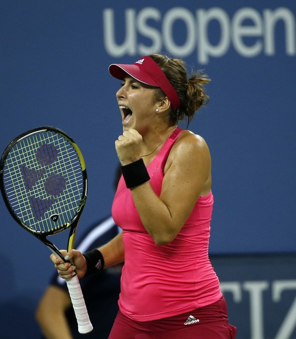 Belinda Bencic, of Switzerland, reacts after winning the first set in a tie-break during her match against Jelena Jankovic, of Serbia, in the fourth round of the 2014 U.S. Open tennis tournament, Sund ...