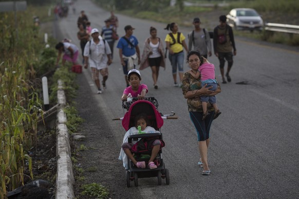 Central American migrants traveling with a caravan to the U.S. make their way to Pijijiapan, Mexico, Thursday, Oct. 25, 2018. The sprawling caravan of migrants hoping to make their way to the United S ...