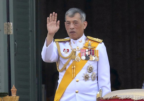 Thailand&#039;s King Maha Vajiralongkorn greets an audience from the balcony of Suddhaisavarya Prasad Hall in the Grand Palace during the coronation ceremony Monday, May 6, 2019, in Bangkok, Thailand. ...