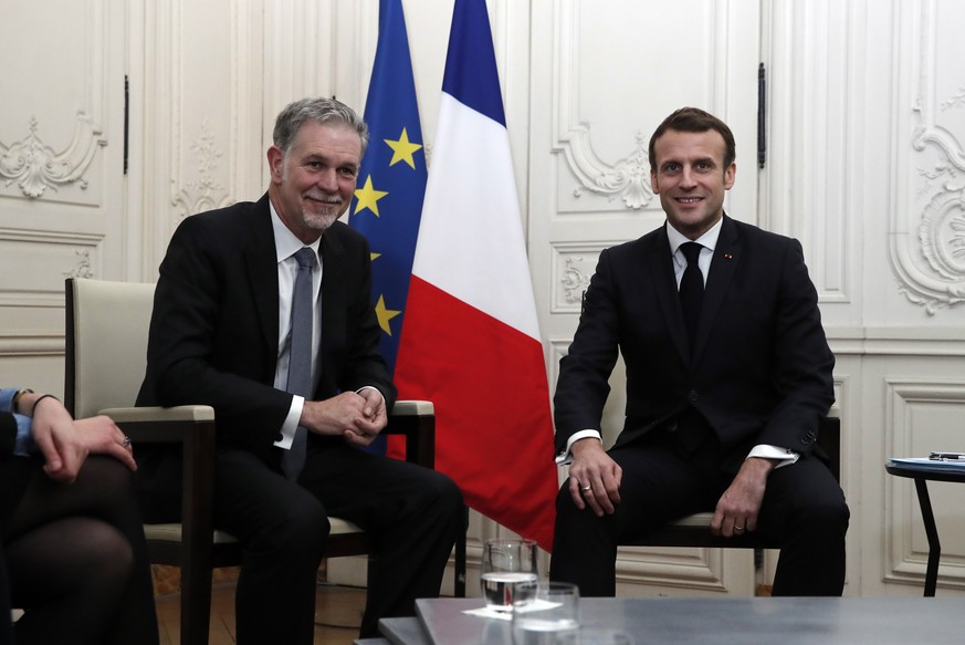 epa08145127 France&#039;s President Emmanuel Macron attends a meeting with Reed Hastings, co-founder and CEO of Netflix, during the Choose France summit at the Chateau de Versailles, outside Paris, Fr ...