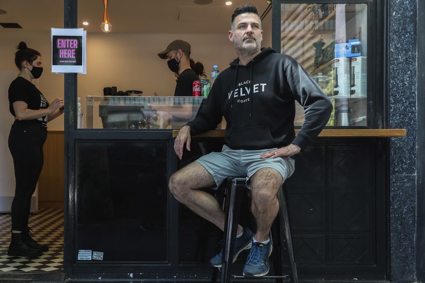Director and founder of Black Velvet coffee shop Darren Silverman poses for a photo outside his cafe in Melbourne, Australia, Wednesday, Oct. 28, 2020. Silverman reopened his coffee shop Wednesday fir ...